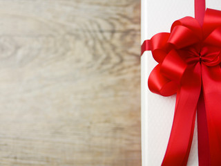 luxury red satin ribbon bow gift box on copy space for season greeting festival 