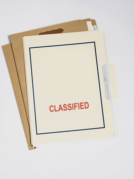 Stack of confidential file folders