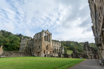Fototapeta premium The ruins of the church Abbey. A shell of a building, stone walls and window arches largely intact but no roof