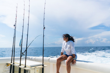 Woman Relaxing on Fishing Boat