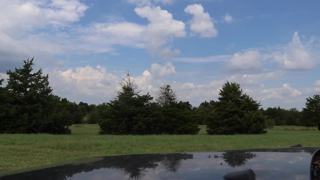 Time-lapse of clouds with blue sky.