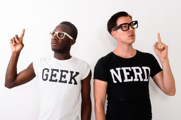 Studio shot of young black African Geek man with European Nerd m