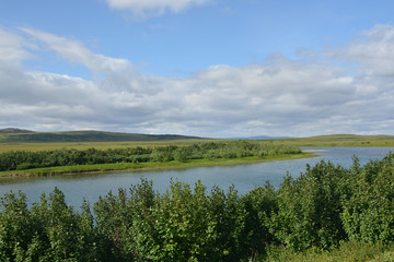 Fototapeta na wymiar Northern river among tundra.