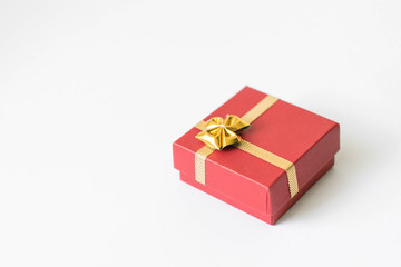 Red Gift Box Tied with Shiny Golden  Ribbon Isolated 