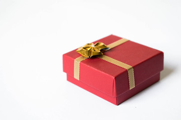 Red Gift Box Tied with Shiny Golden  Ribbon Isolated 