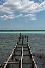 Old broken pier at the lagoon of Bacalar, Quintana Roo, Mexico