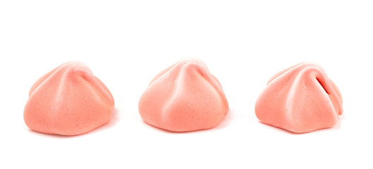 Line of Three Pink Meringues on a White Background