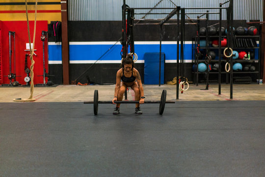 Woman Working Out with Barbell