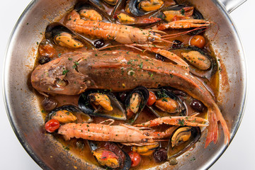 Pan with Tub gurnard prawn mussels olives and tomatoes