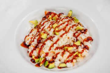 Delicious rice with fresh slices of vegetables and gravy, isolated