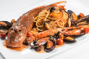 Plate of spaghetti with Tub gurnard prawn mussels olives and tomatoes