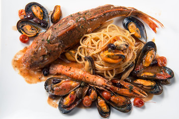 Plate of spaghetti with Tub gurnard prawn mussels olives and tomatoes