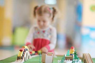 Child in the children's room. Happy child with toys.