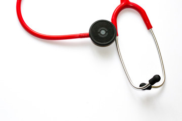 Red stethoscope with black membrane and white sticker isolated on white background. Medicine concept - instrument for auscultation.  Cardiology practice.