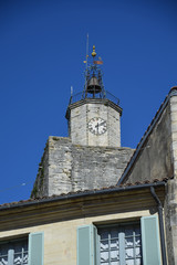 Fototapeta premium Clock tower in the main square of the medieval village of Uzes in the Gard region of Provence, France