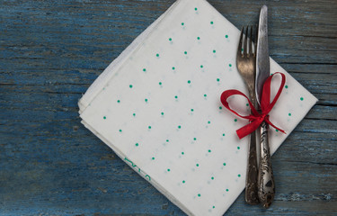 Antique cutlery on dark wooden background