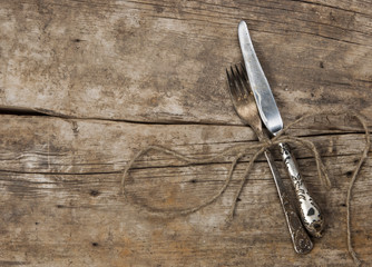 Antique cutlery on dark wooden background