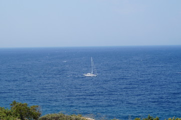 Blue sea, away yacht