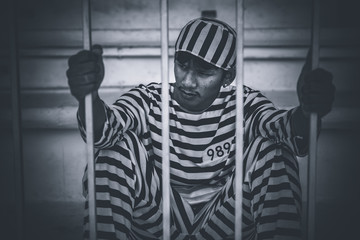 Portrait of prisoner desperate to catch the iron prison,prisoner concept,thailand people,Hope to be...