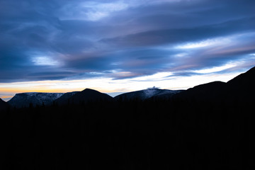 Last ray, sunset over the mountains in autumn