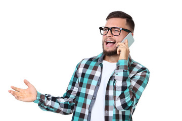 Emotional young man talking on a mobile phone on white background © 5second