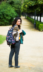 Beautiful woman with brunette hair in the park