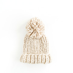 Warm female knitted hat isolated on white background. Flat lay, top view minimal fashion concept.