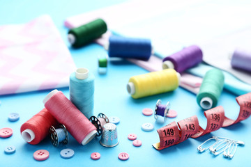 Sewing accessories on blue background