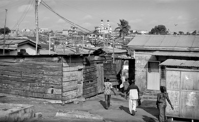  Residential infrastructure of Ghana. Poverty and poor housing conditions. Lifestyle of people from dense located slum houses. Ghana, Accra, Nima area