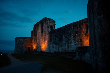 Beautiful sunset on ancient Stafford Castle with colorful sky and light on castle.