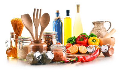 Assorted food products and kitchen utensils isolated on white