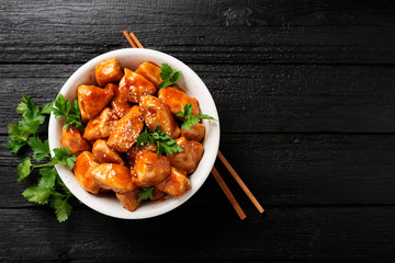 Spicy sweet and sour general tso chicken .