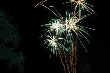 Green firework in night city