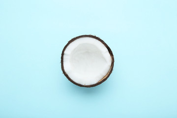 Fototapeta premium Piece of coconut on blue background