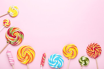 Colorful lollipops on pink background