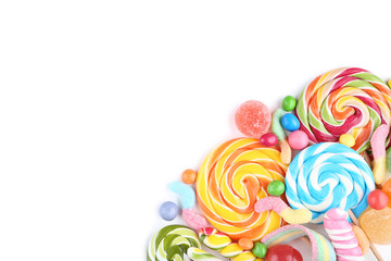 Fototapeta na wymiar Sweet candies and lollipops on white background