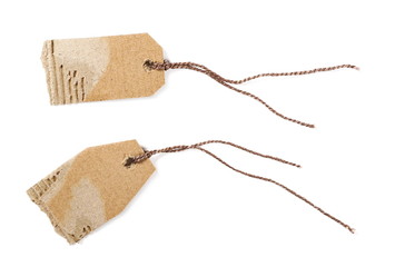 Blank cardboard tag tied with string isolated on white background