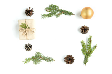 Christmas composition of Christmas balls, gift box, cones and fir branches isolated on white background.