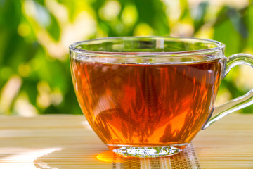 Tea composition on meadow and flowers