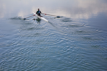 Single scull rowing competitor, rowing race one rower © smuki