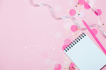 Empty note pad - mock up template with pink confetti on pink background