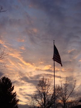 Sunset behind the American Flag