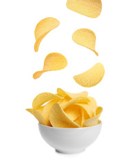 Fototapeta na wymiar Bowl of tasty crispy potato chips on white background
