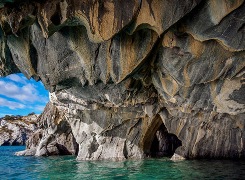 View of Marble Caves in General Carrera Lake against cloudy sky