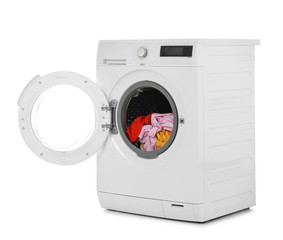 Fototapeta premium Modern washing machine with laundry on white background