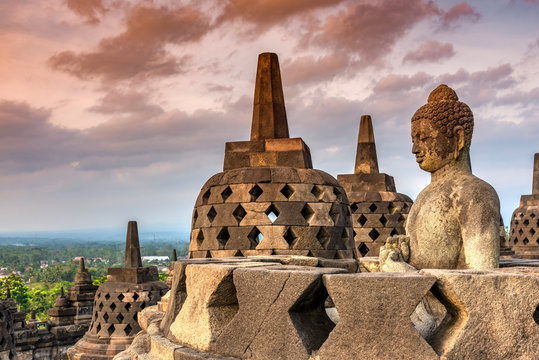 Buddha statue at Borobudur Temple during sunset