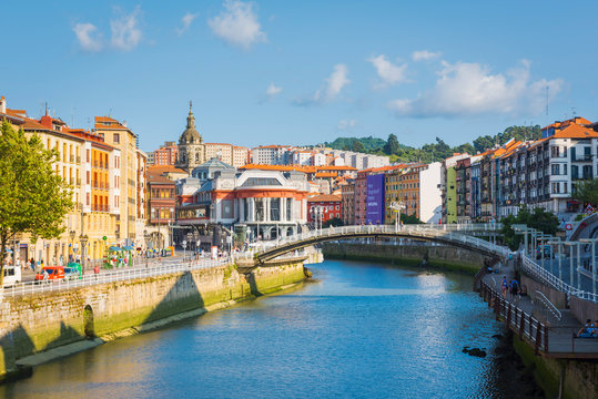 Spain, Basque Country, Bilbao. Nervion river and the Mercado de la Ribera market.