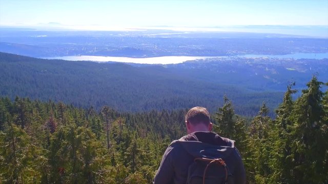 Guy taking pics of the BC mountains.