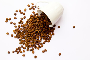 Coffee cup and beans on a white background. Top view.