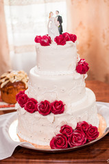 White and red wedding cake on the table